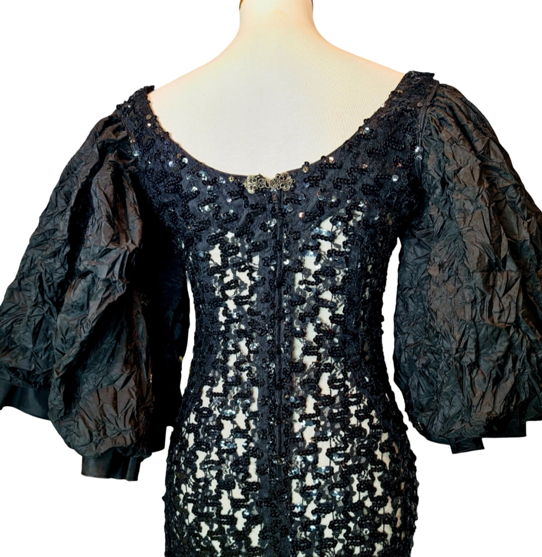 Campana Mermaid Dress. Couture sophisticated. Red carpet look. We love everything about this dress. Screams sophisticated. Mermaid dress with big ruffle sleeves. See through, add your undergarment to your liking. It's all in the details...