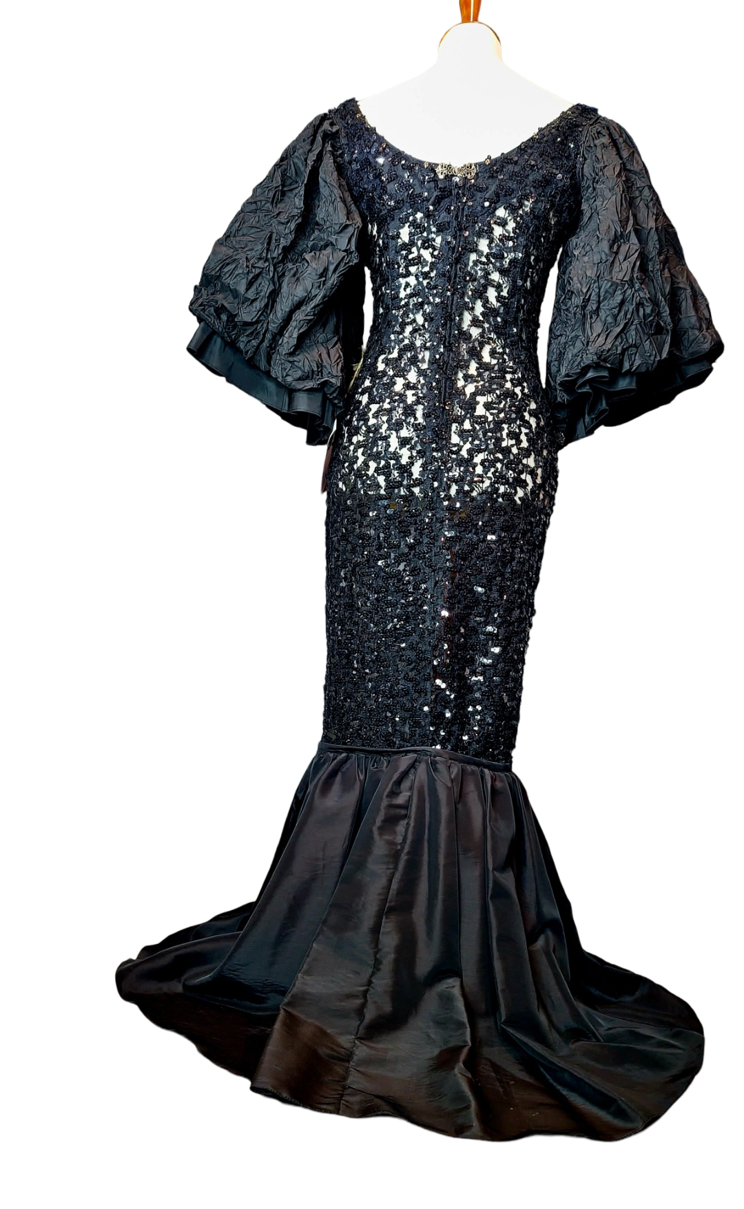 Campana Mermaid Dress. Couture sophisticated. Red carpet look. We love everything about this dress. Screams sophisticated. Mermaid dress with big ruffle sleeves. See through, add your undergarment to your liking. It's all in the details...