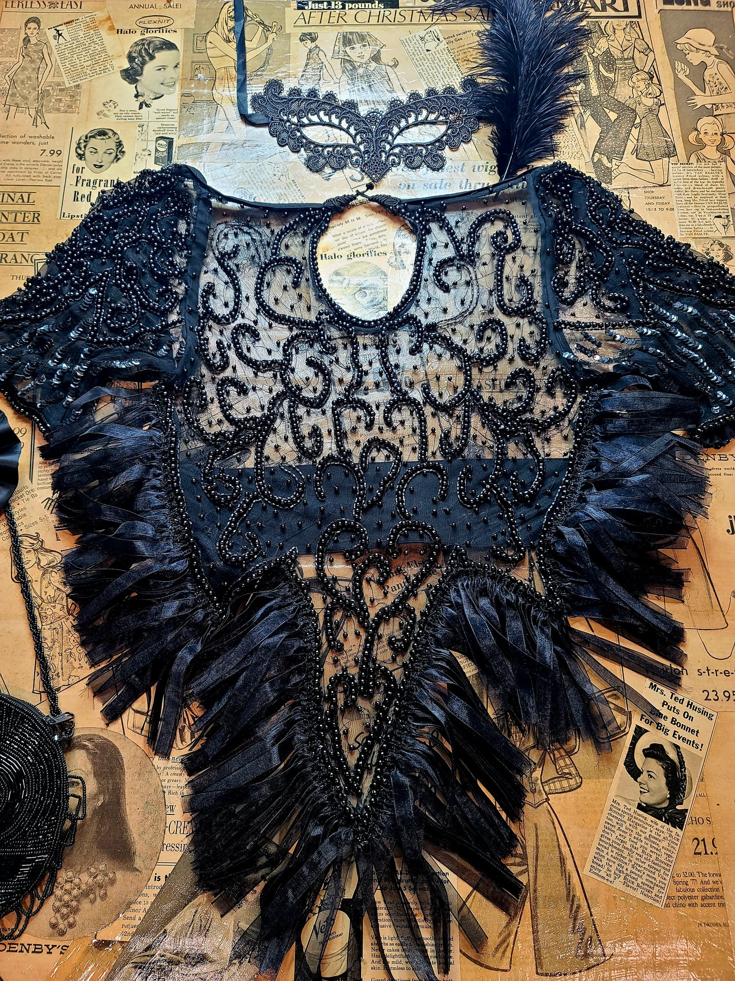 Magical Decorative Top Show Stopper. Sexy sheer. Ultimate feminine top. Makes a statement. Eye-catching. It' all in the details. Crafted and re-vamp mesh fabric and beads details. Round neck. Beautiful flare. Backless with elastic band...