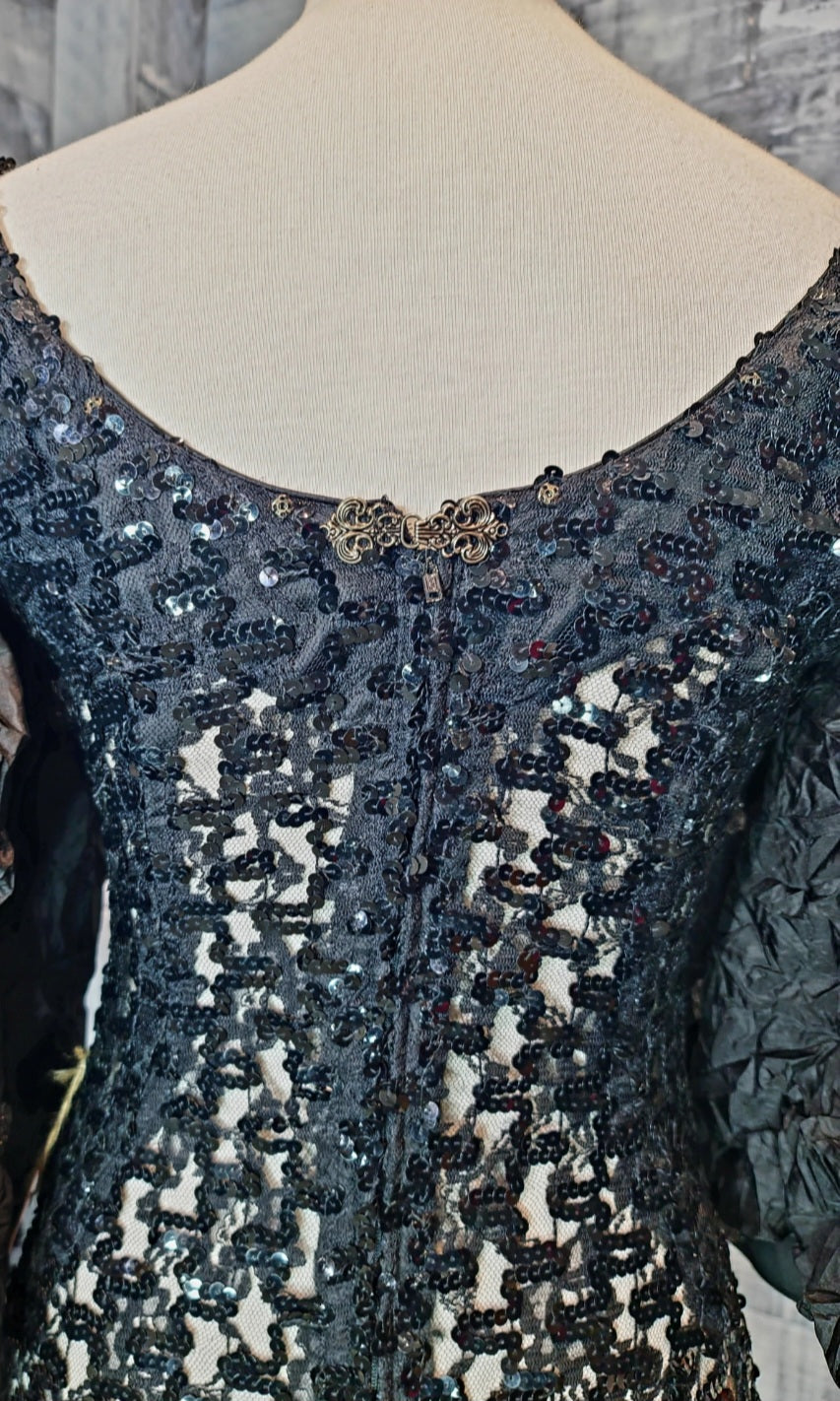 Campana Mermaid Dress. Couture sophisticated. Red carpet look. We love everything about this dress. Screams sophisticated. Mermaid dress with big ruffle sleeves. See through, add your undergarment to your liking. It's all in the details...
